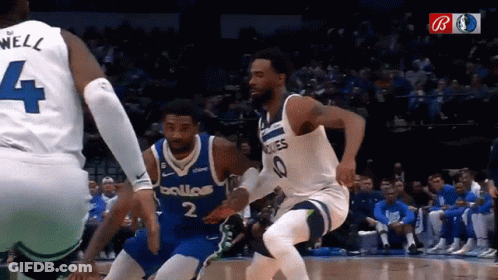 Basketball Player In Dallas Jersey Trying To Get Past Another Player GIF