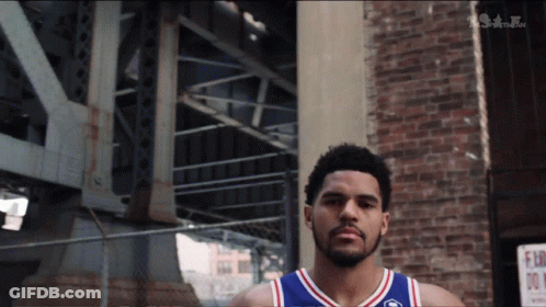 Basketball Player In Front Of Brick Building GIF