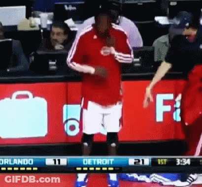 Basketball Player In Front Of Detroit Sign GIF