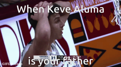 Basketball Player In Front Of North Main Street Sign GIF