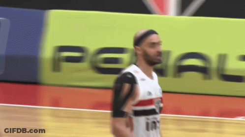 Basketball Player In Front Of Penal Banner GIF