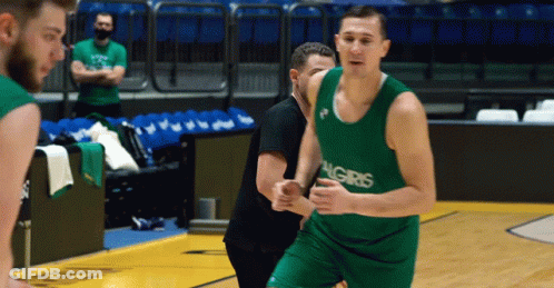 Basketball Player In Green Algiris Jersey Dribbling GIF