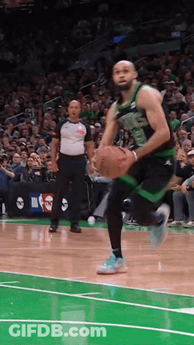 Basketball Player In Green And Black Uniform Number 23 GIF