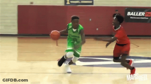Basketball Player In Green Dribbling Past Red Player GIF