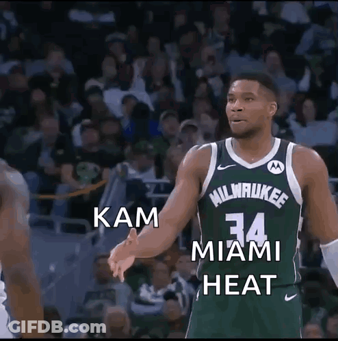 Basketball Player In Green Jersey Number 34 In Front Of Crowd GIF