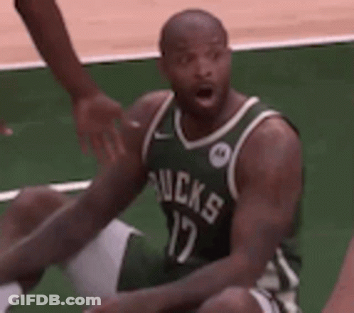 Basketball Player In Green Jersey Sitting On Floor GIF
