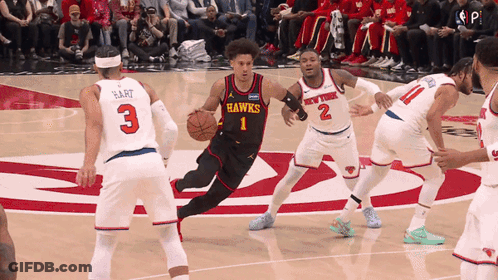 Basketball Player In Hawks Jersey Dribbling GIF