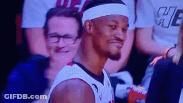 Basketball Player In Headband And Glasses Sitting In Stands GIF