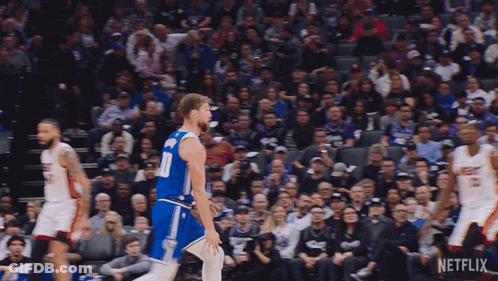 Basketball Player In Heat Jersey Blocking Opponent GIF