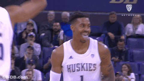 Basketball Player In Huskies Jersey Laughing During Game GIF