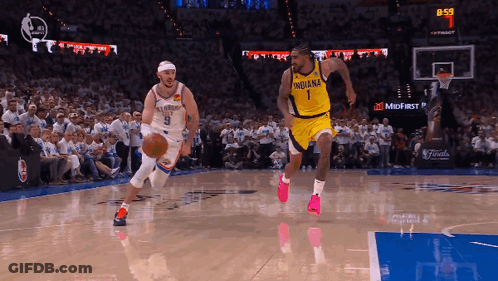 Basketball Player In Indiana Jersey Dribbling GIF