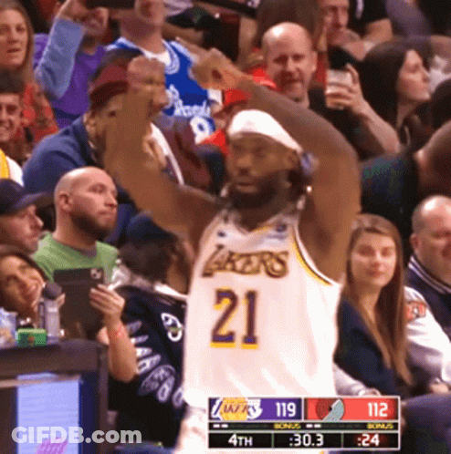 Basketball Player In Lakers Jersey Raising Fist GIF
