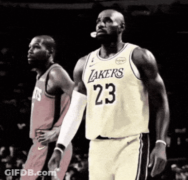 Basketball Player In Lakers Jersey Standing Next To Another Player GIF