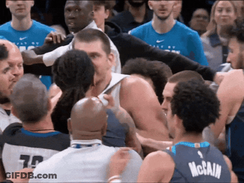 Basketball Player In McCain Jersey Surrounded GIF