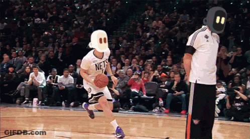 Basketball Player In Nets Jersey Dribbling GIF