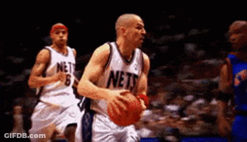 Basketball Player In Nets Jersey Dribbling GIF