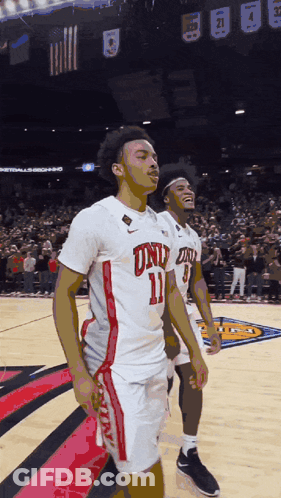 Basketball Player In Number 11 Jersey Standing On Court GIF