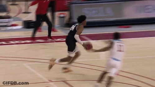 Basketball Player In Number 23 Jersey Dribbling GIF