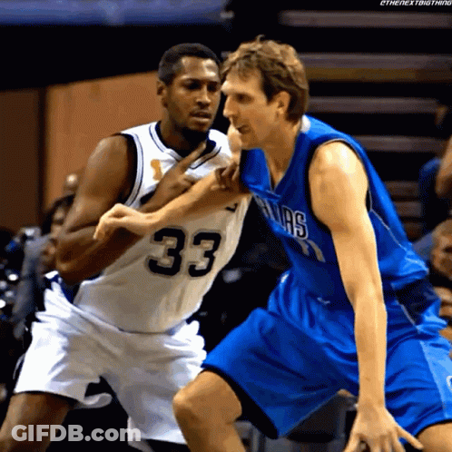 Basketball Player In Number 33 Jersey Blocking Another Player GIF