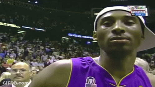 Basketball Player In Purple Jersey And White Hat Looking GIF