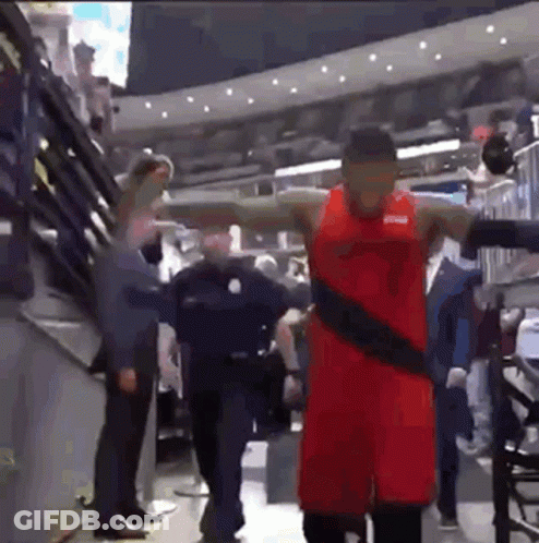 Basketball Player In Red Uniform Standing In Stadium GIF