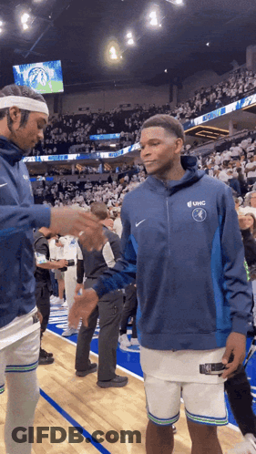 Basketball Player In UHC Sweatshirt Shaking Hands GIF