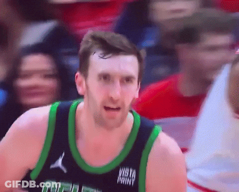 Basketball Player In Vista Paint Jersey Looking At Camera GIF