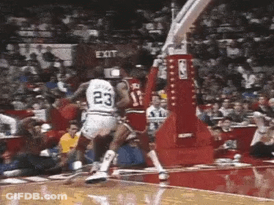 Basketball Player In White Jersey Number 23 Jumping Over Player GIF