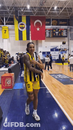 Basketball Player In Yellow And Black Jersey Number 7 GIF
