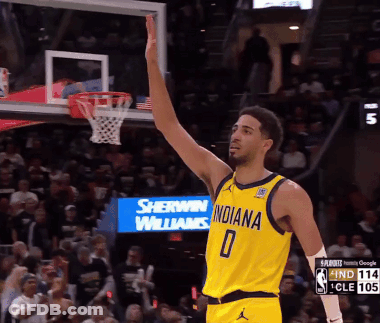 Basketball Player In Yellow Indiana Jersey Raising Arm GIF