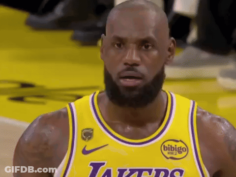 Basketball Player In Yellow Jersey And Purple Bib GIF