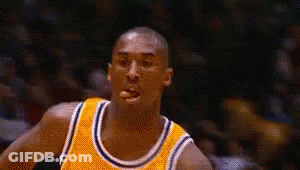 Basketball Player In Yellow Jersey Looking At Camera GIF