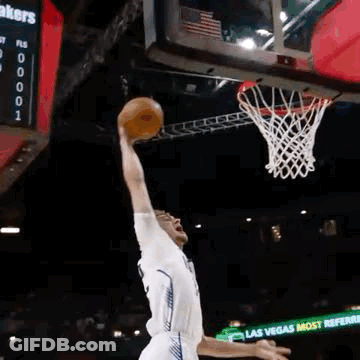 Basketball Player In Yellow Jersey Standing Next To Player In White Jersey GIF