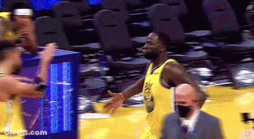 Basketball Player In Yellow Jersey Walking GIF