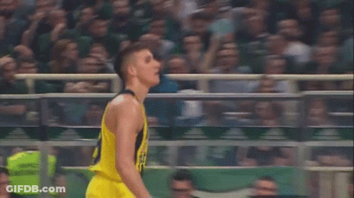 Basketball Player In Yellow Jersey With Crowd GIF