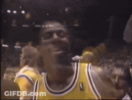 Basketball Player In Yellow Jersey With Letter T GIF