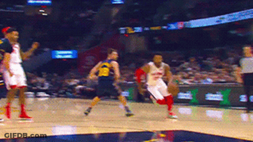 Basketball Player In Yellow Michigan Jersey GIF