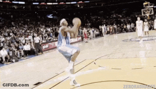 Basketball Player Jumping Holding Basketball GIF