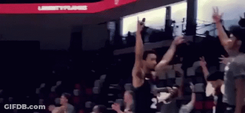 Basketball Player Jumping In Air As Crowd Watches GIF