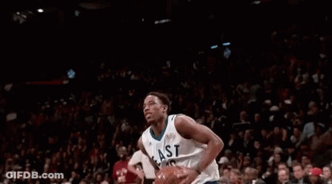 Basketball Player Jumping With Ball In Front Of Crowd GIF