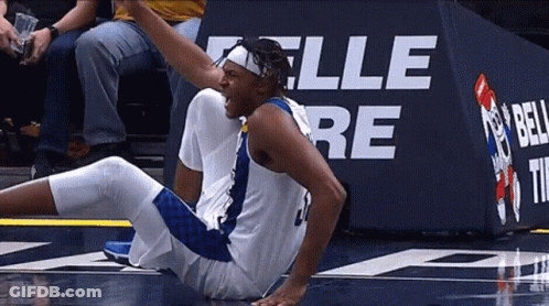 Basketball Player Lying In Front Of Bell Sign GIF