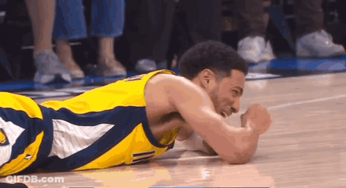 Basketball Player Lying On Floor GIF