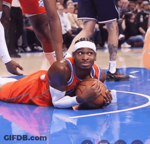 Basketball Player Lying On Floor With Ball GIF