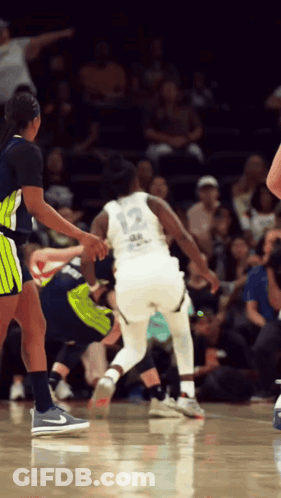 Basketball Player Number 12 Dribbling GIF