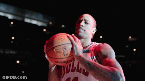 Basketball Player Number 12 Holding Ball GIF