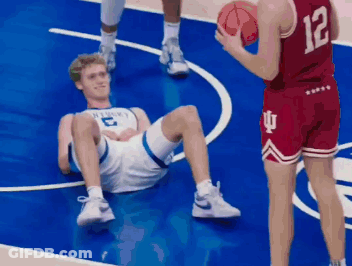Basketball Player Number 12 Holding Basketball GIF