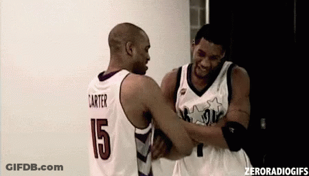 Basketball Player Number 15 Hugging Another Player GIF