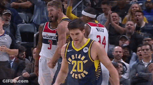 Basketball Player Number 20 Surrounded By Players GIF