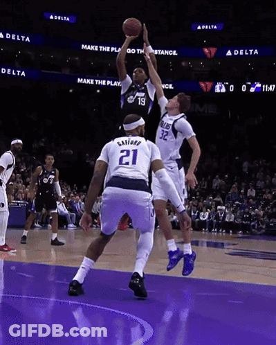 Basketball Player Number 21 Jumping To Catch Ball GIF