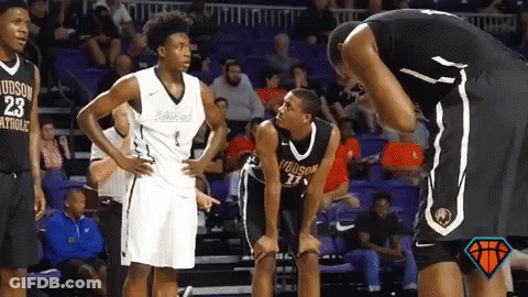 Basketball Player Number 23 Talking To Another Player GIF